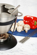 closeup of oil fondue with vegetables