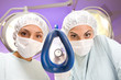 Anesthesiologist putting an oxygen mask on