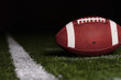 Football resting on the first down line