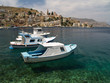 Boats in a transparent sea water