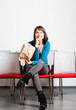 happy young woman sitting and looking up
