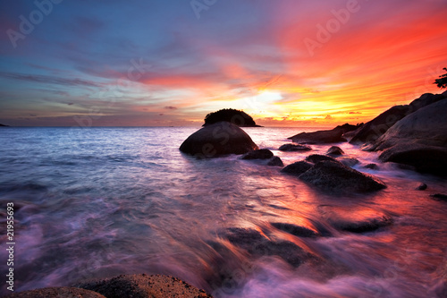 Photo: Tropical sunset in the sea. Thailand Tropical sunset in the sea. Thailand