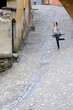 young tourist dancing with umbrella
