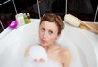 Attractive woman playing in a bubble bath Attractive woman playing in a bubble bath