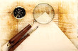 Compass and magnifier  on old textured paper
