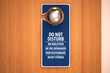 Do not disturb sign on a door knob