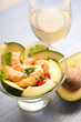 shrimp cocktail with avocado and glass of wine