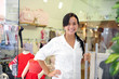 Photo: small business owner: proud woman opening her store small business owner: proud woman opening her store