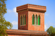 brick tower with trifora windows