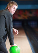 Portrait of young man prepared on bowling lane