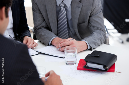 Photo: Serious businessmen having a brainstorming Serious businessmen having a brainstorming