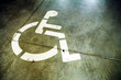 Disability sign on grunge background garage floor Disability sign on grunge background garage floor