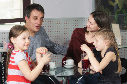 Photo: Happy family in cafe Happy family in cafe