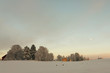 Houses in a small forest a cold winter day in Scandinavia Houses in a small forest a cold winter day in Scandinavia