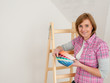 Woman choose the color of wall