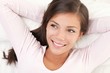 Woman smiling in bed Woman smiling in bed