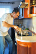 Photo: Man in kitchen Man in kitchen