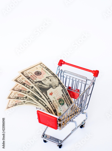 Photo: money and shopping cart money and shopping cart