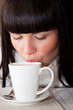 Foto: Woman's lips on cup of coffee Woman's lips on cup of coffee