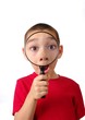 Boy looking through magnifying glass