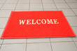 Red Welcome Mat At Doorstep Red Welcome Mat At Doorstep