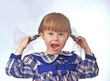 little girl grimaces