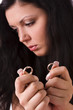Divorce. Sad woman holding gold wedding ring. Divorce. Sad woman holding gold wedding ring.