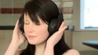 Close-up of a charming woman listening music at home Close-up of a charming woman listening music at home