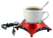 Cup with coffee and USB device for heating on a white.