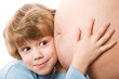 child listens to a stomach