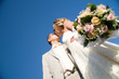 kissing wedding pair