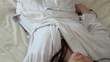 Dreamy woman listening music lying down on bed Dreamy woman listening music lying down on bed