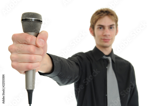 Photo: Man holding microphone Man holding microphone