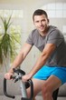 Man training on exercise bike Man training on exercise bike