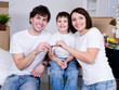 Happy family in the new flat