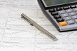 Pen, Calculator And Newspaper