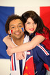 Jeune homme et femme supporter des français
