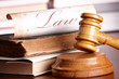 Judges gavel with very old books