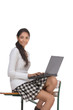 Indian college student woman with computer sitting on desk with