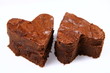 Two heart shaped slices of a brownie on white background Two heart shaped slices of a brownie on white background
