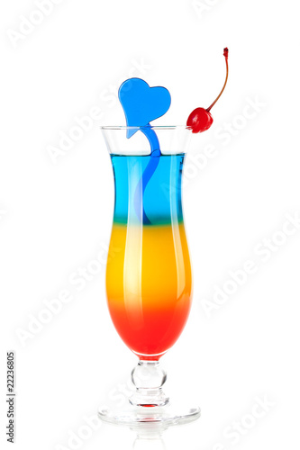 Photo: Layered tropical cocktail with blue heart decoration Layered tropical cocktail with blue heart decoration