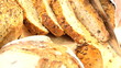 Fresh organic bread being sllced to eat Fresh organic bread being sllced to eat