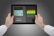 hands holding a touchpad pc, using the music programme