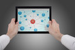 hands holding a touchpad pc and surfing in the social network