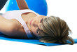 Sportswoman lying on a mat.