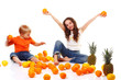 boy and a girl with lots of fruit