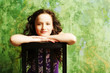 beautiful young teen girl sitting on chair posing