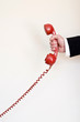holding red telephone