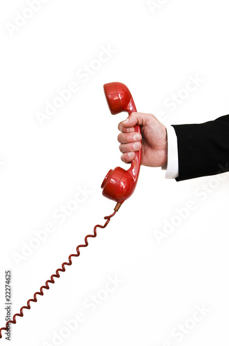 Photo: holding red retro telephone holding red retro telephone