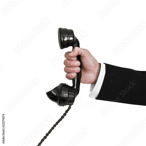 Photo: Businessman holding retro telephone Businessman holding retro telephone
